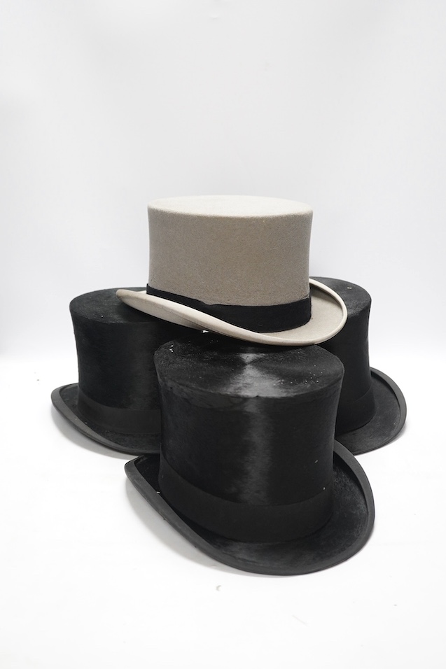 Three gentlemen’s black silk top hats and a similar grey top hat and box. Condition - grey hat good, others poor